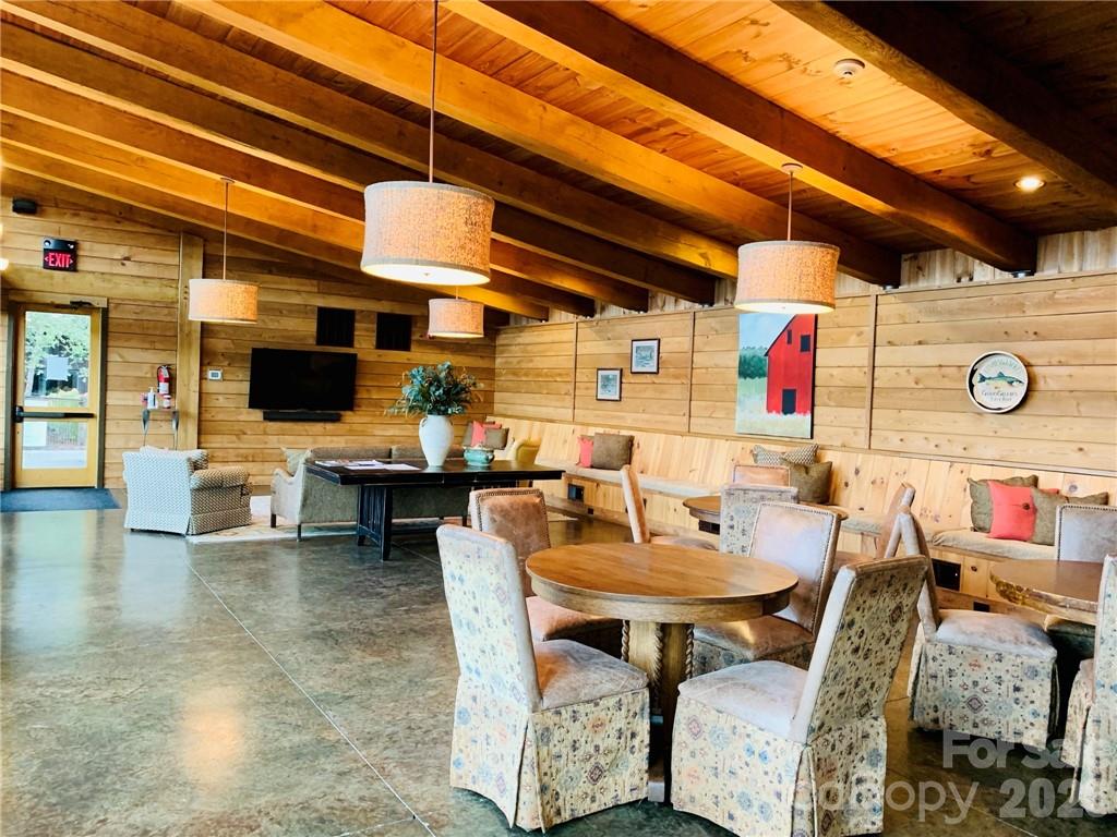 75 Wild Turkey Loop, Unit 31 Marshall, NC 28753 - Photo 14 of 38 a outdoor dining space with furniture and flat screen tv