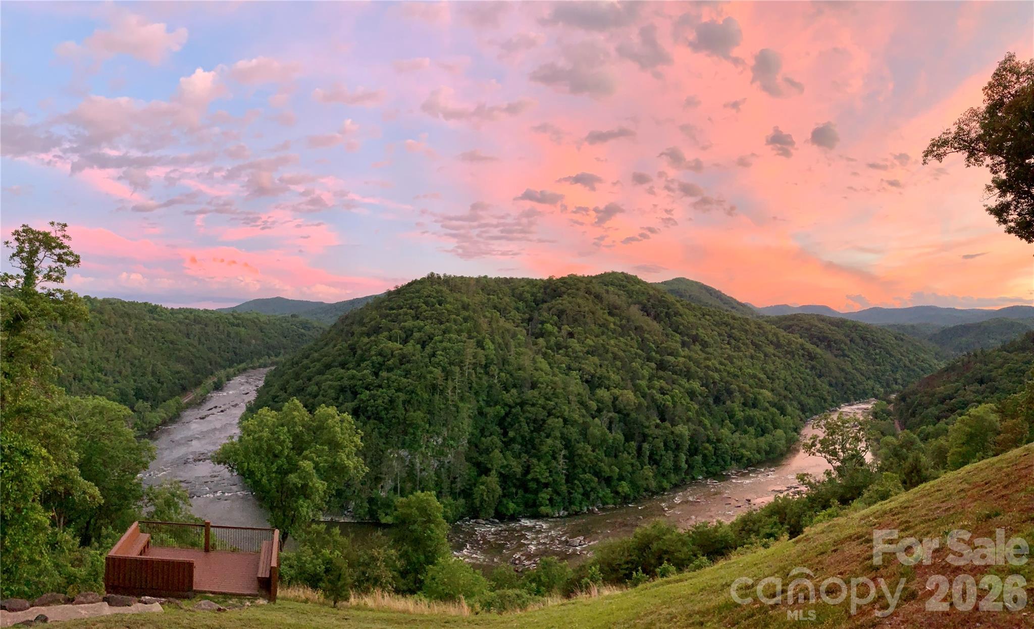 75 Wild Turkey Loop, Unit 31 Marshall, NC 28753 - Photo 20 of 38 a view of a city with lush green forest