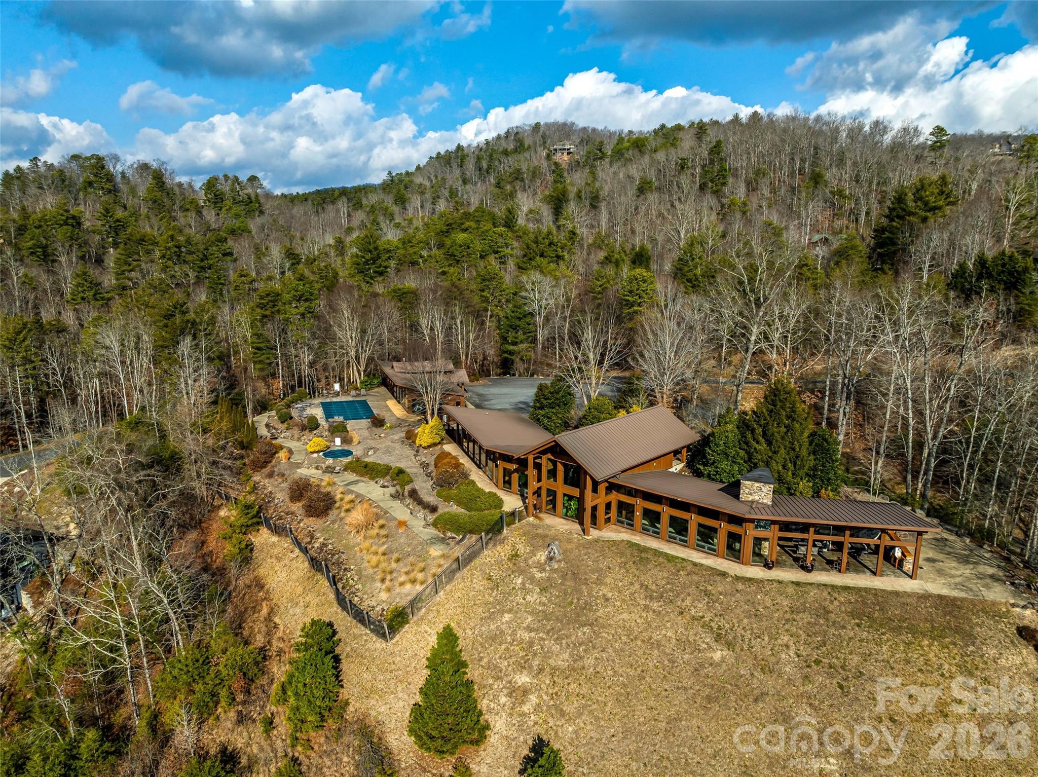 75 Wild Turkey Loop, Unit 31 Marshall, NC 28753 - Photo 22 of 38 a view of a backyard with plants and a patio