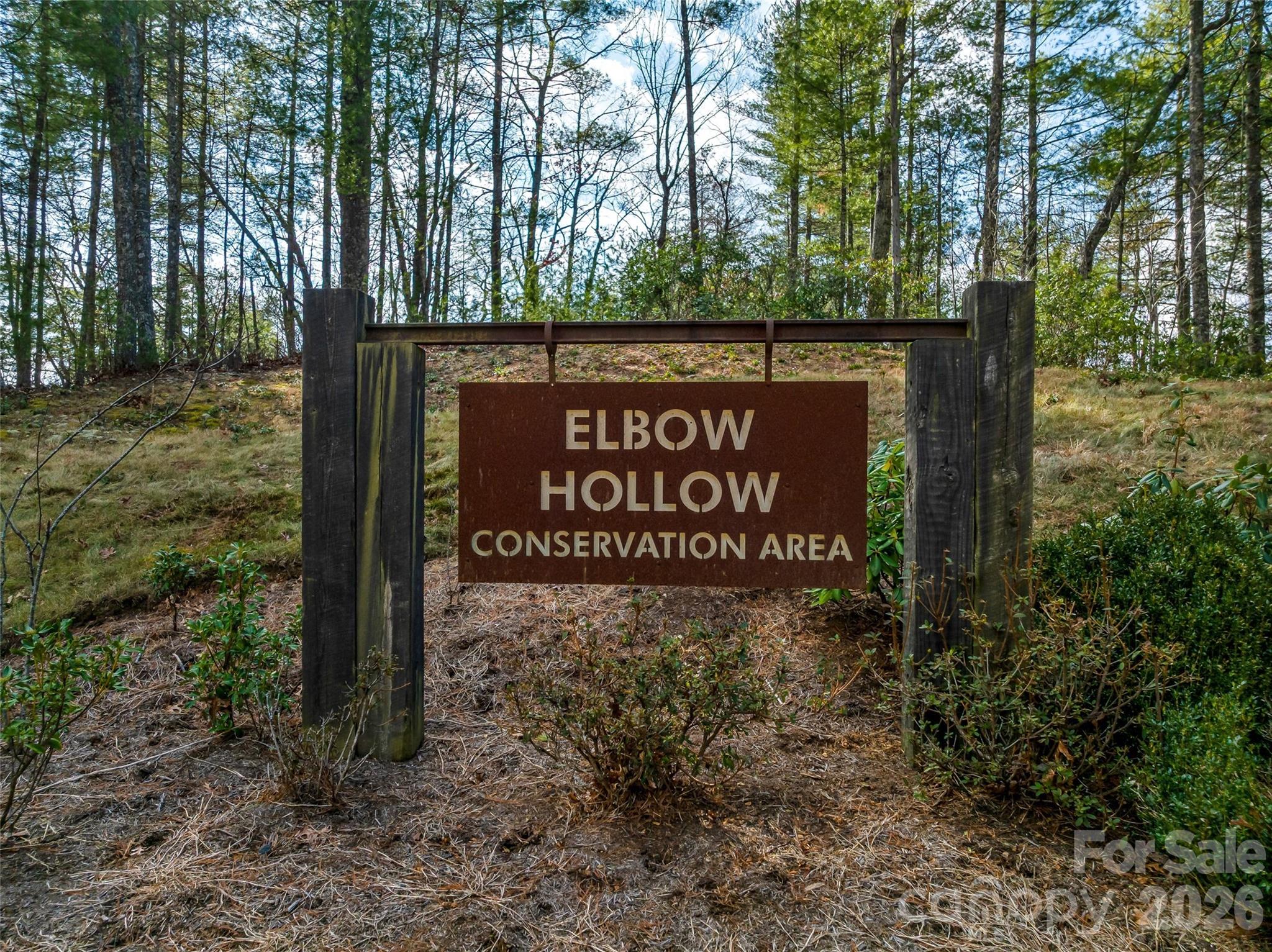 75 Wild Turkey Loop, Unit 31 Marshall, NC 28753 - Photo 37 of 38 a sign broad in front of the red tree