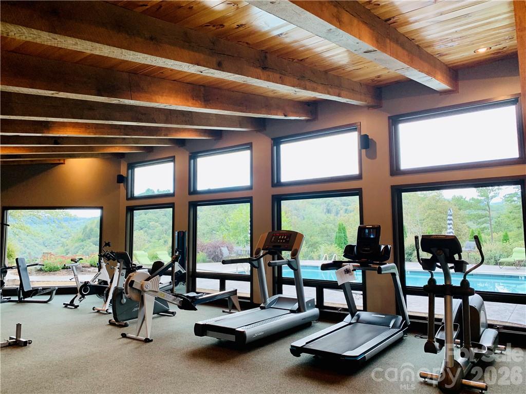 75 Wild Turkey Loop, Unit 31 Marshall, NC 28753 - Photo 9 of 38 a living room with furniture and floor to ceiling windows