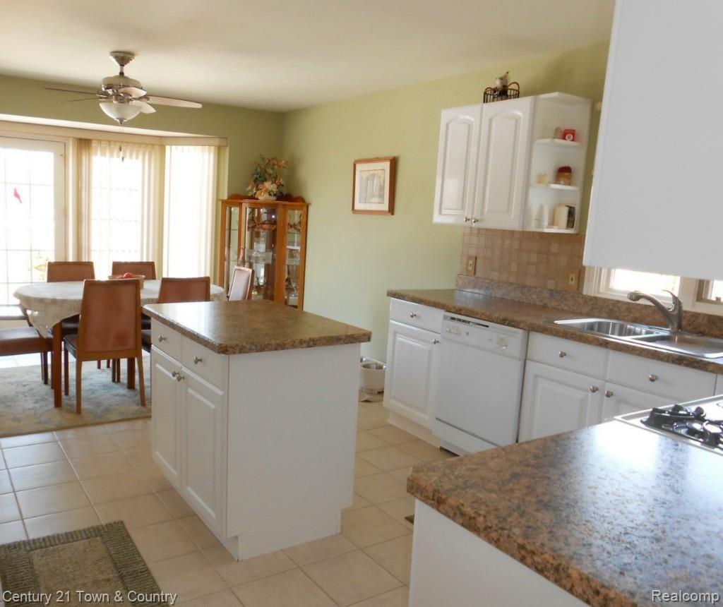 2908 Alexander Street Rochester, MI 48309 - Photo 8 of 38 White Kitchen w/Island & Tile Flooring