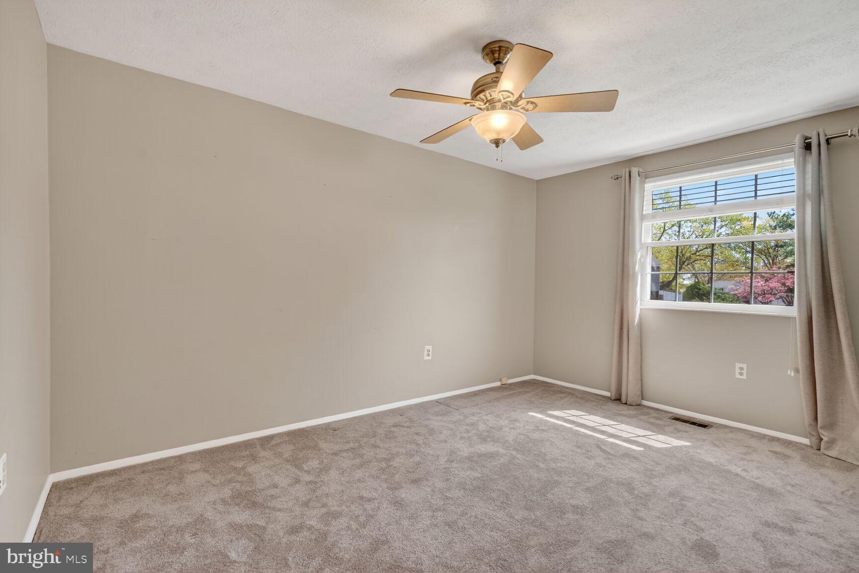 2806 Logway Road Vienna, VA 22181 - Photo 18 of 33 an empty room with window and ceiling fan