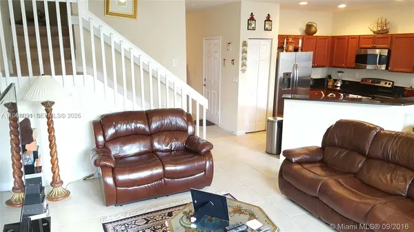 a living room with furniture and a couch