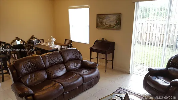 a living room with furniture and a window