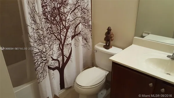 a bathroom with a sink and toilet
