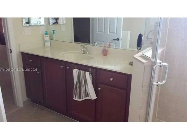 a bathroom with a sink and a mirror