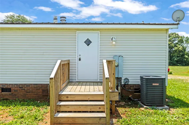 a view of a patio with two chairs and a table