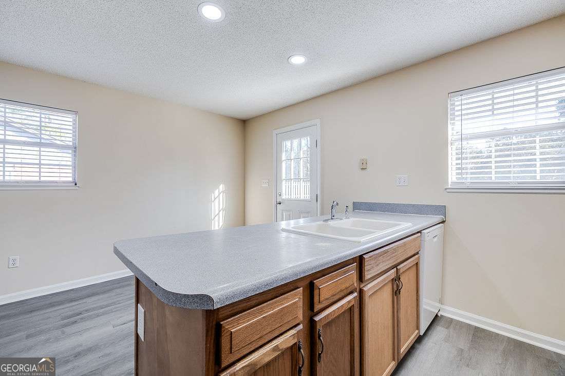 145 John Glenn Drive Rincon, GA 31326 - Photo 12 of 29 a kitchen with a sink a counter space and a window
