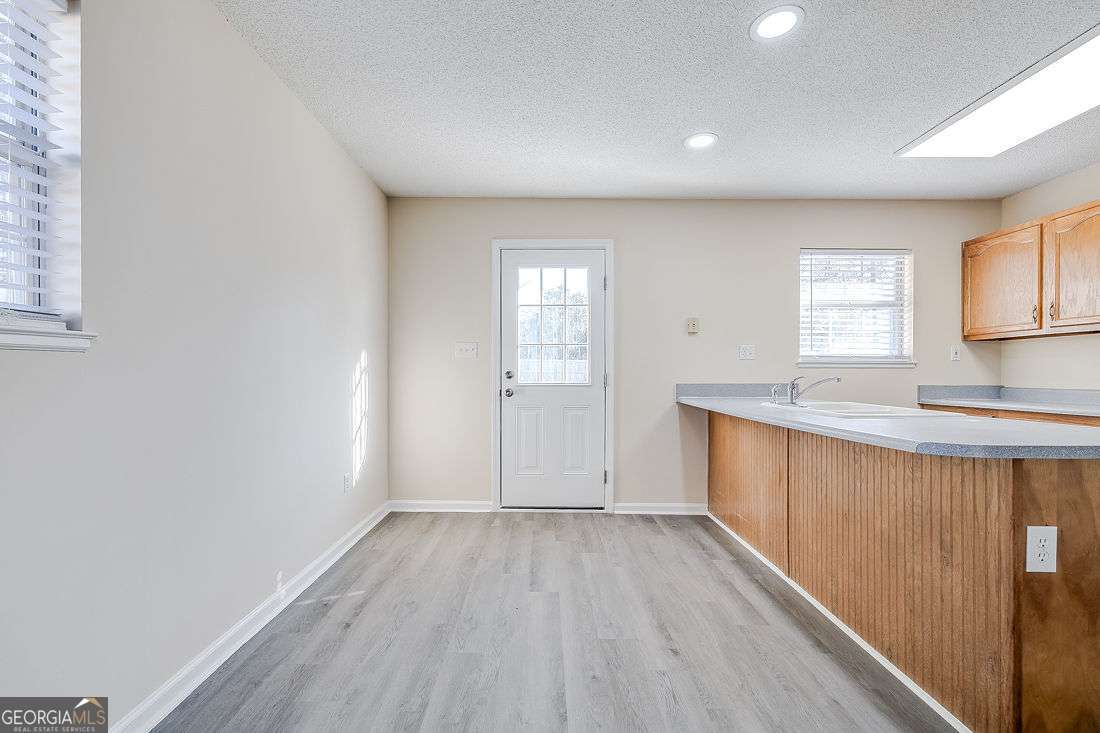 145 John Glenn Drive Rincon, GA 31326 - Photo 15 of 29 a view of a kitchen with wooden floor and a sink