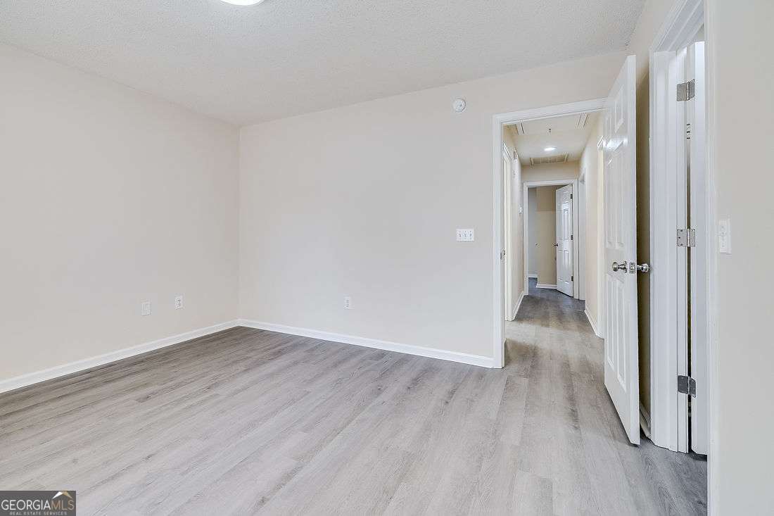 145 John Glenn Drive Rincon, GA 31326 - Photo 17 of 29 wooden floor in a hallway