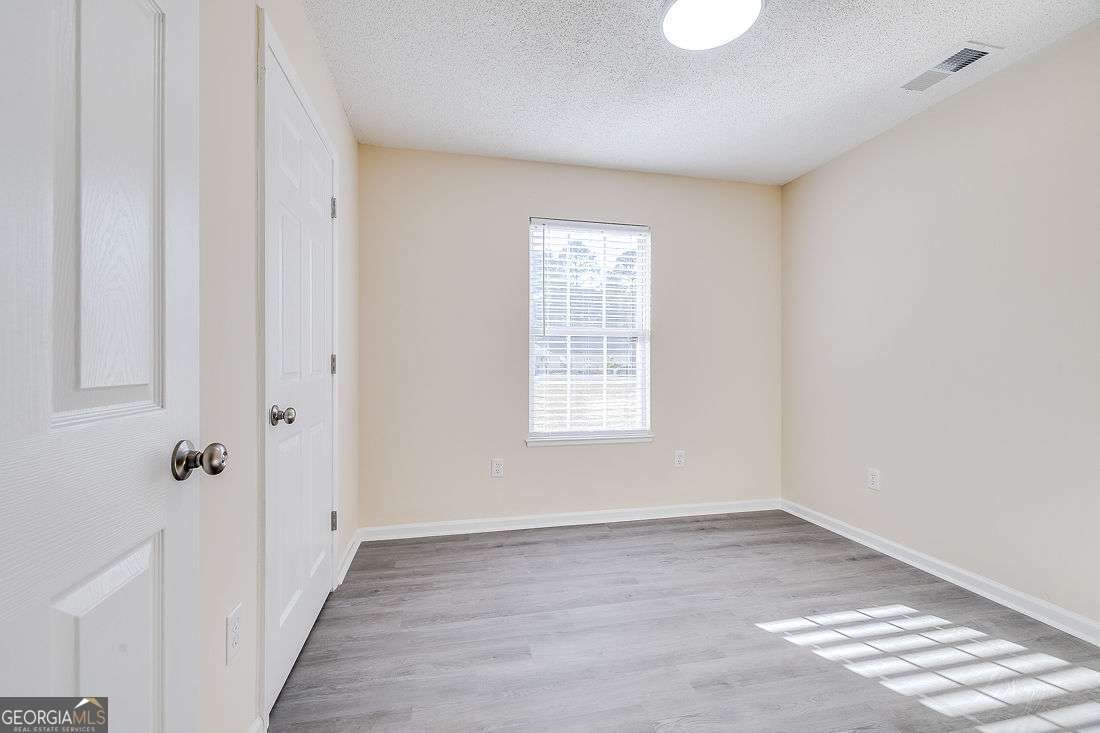 145 John Glenn Drive Rincon, GA 31326 - Photo 24 of 29 a view of a room with wooden floor and windows