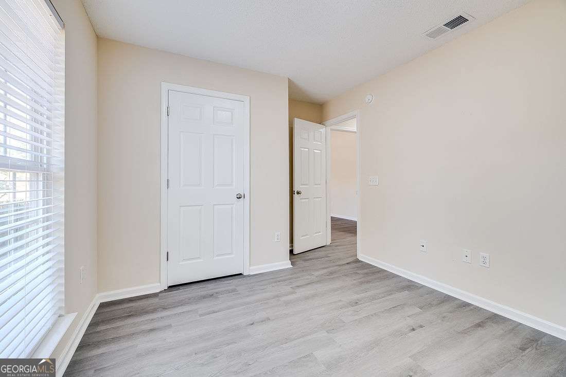 145 John Glenn Drive Rincon, GA 31326 - Photo 26 of 29 an empty room with wooden floor