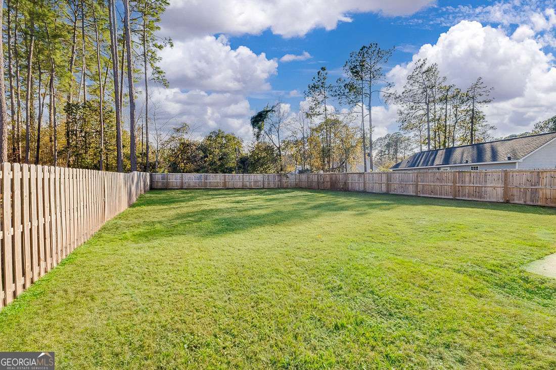 145 John Glenn Drive Rincon, GA 31326 - Photo 28 of 29 a view of a yard with a large trees
