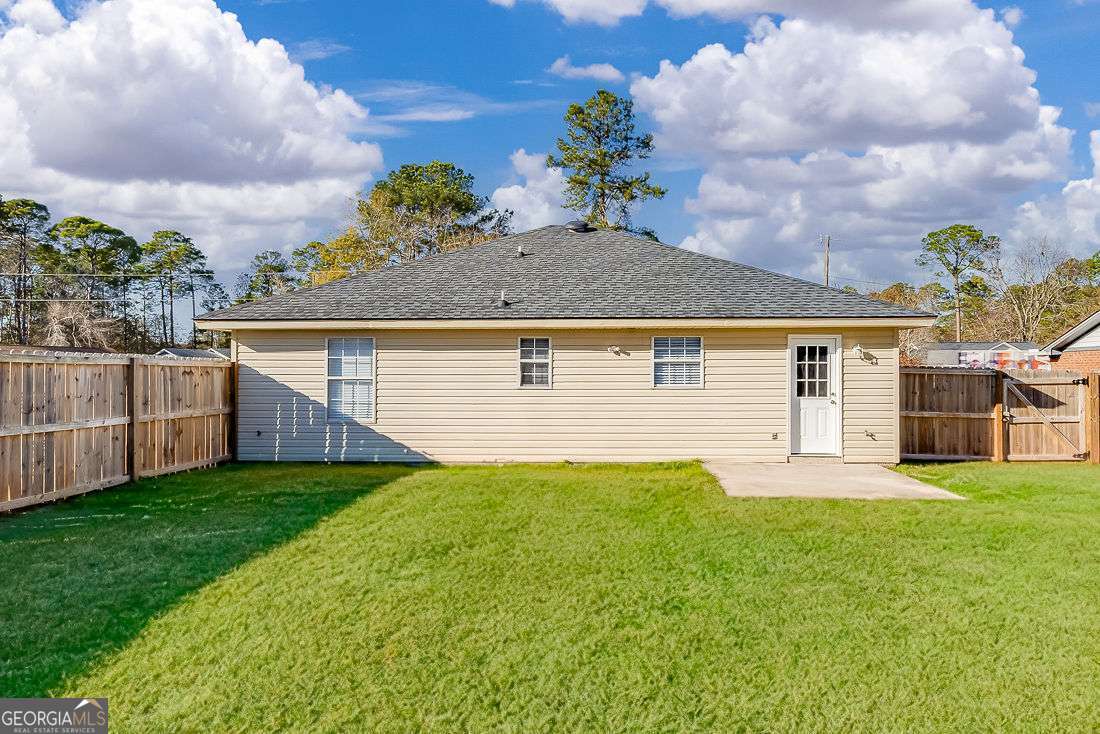 145 John Glenn Drive Rincon, GA 31326 - Photo 29 of 29 a view of a house with a yard and pathway