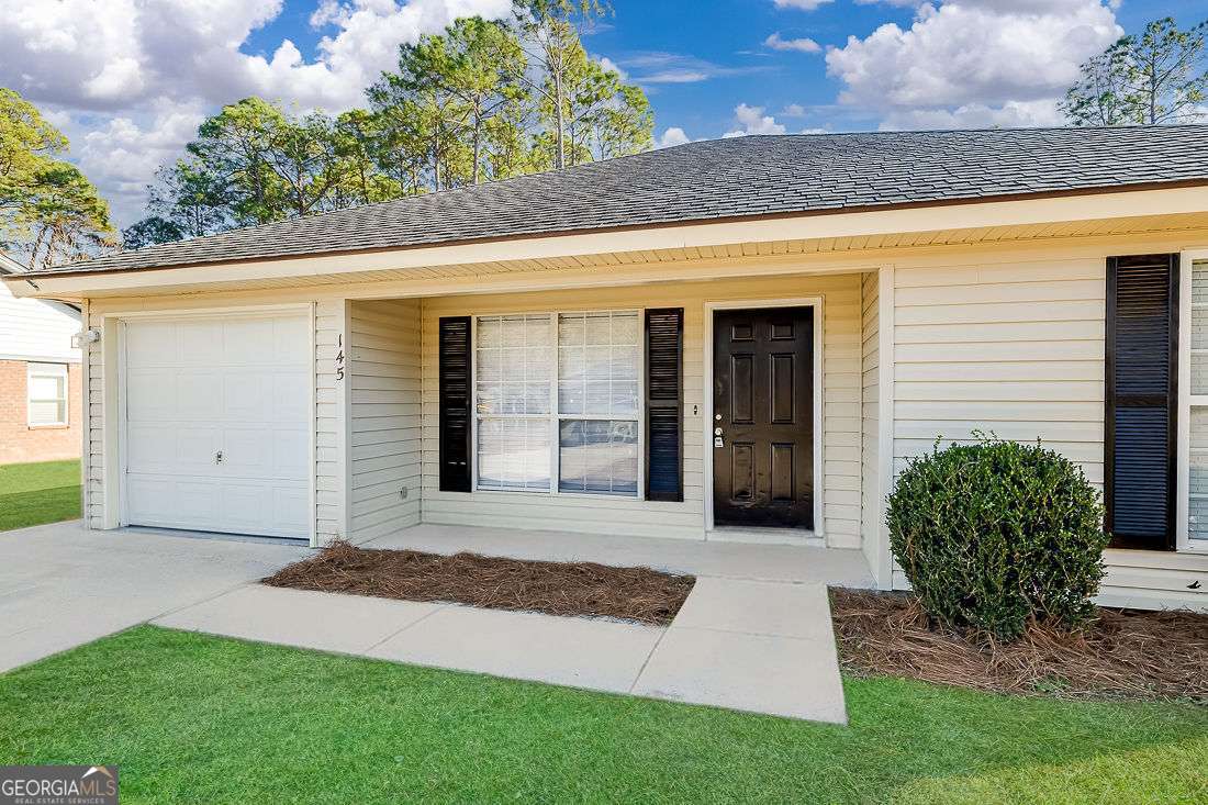 145 John Glenn Drive Rincon, GA 31326 - Photo 4 of 29 a view of a back yard of the house