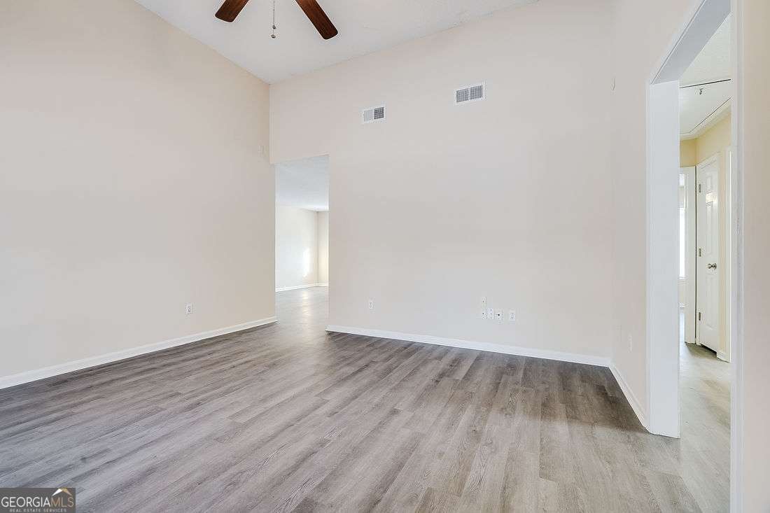 145 John Glenn Drive Rincon, GA 31326 - Photo 5 of 29 a view of an empty room with wooden floor