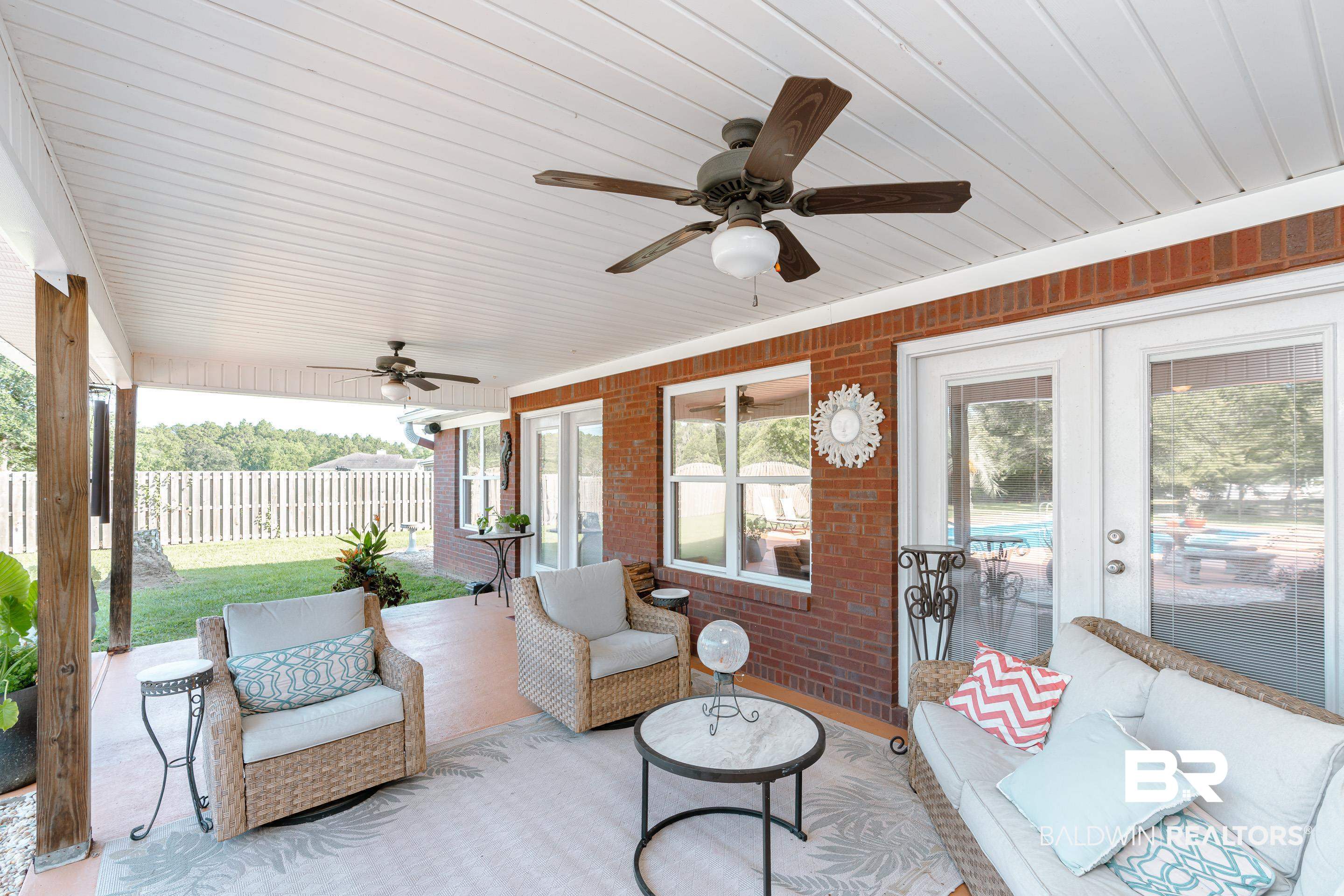 9477 Deerfield Drive Irvington, AL 36544 - Photo 40 of 58 Sunroom / solarium with ceiling fan and french doors
