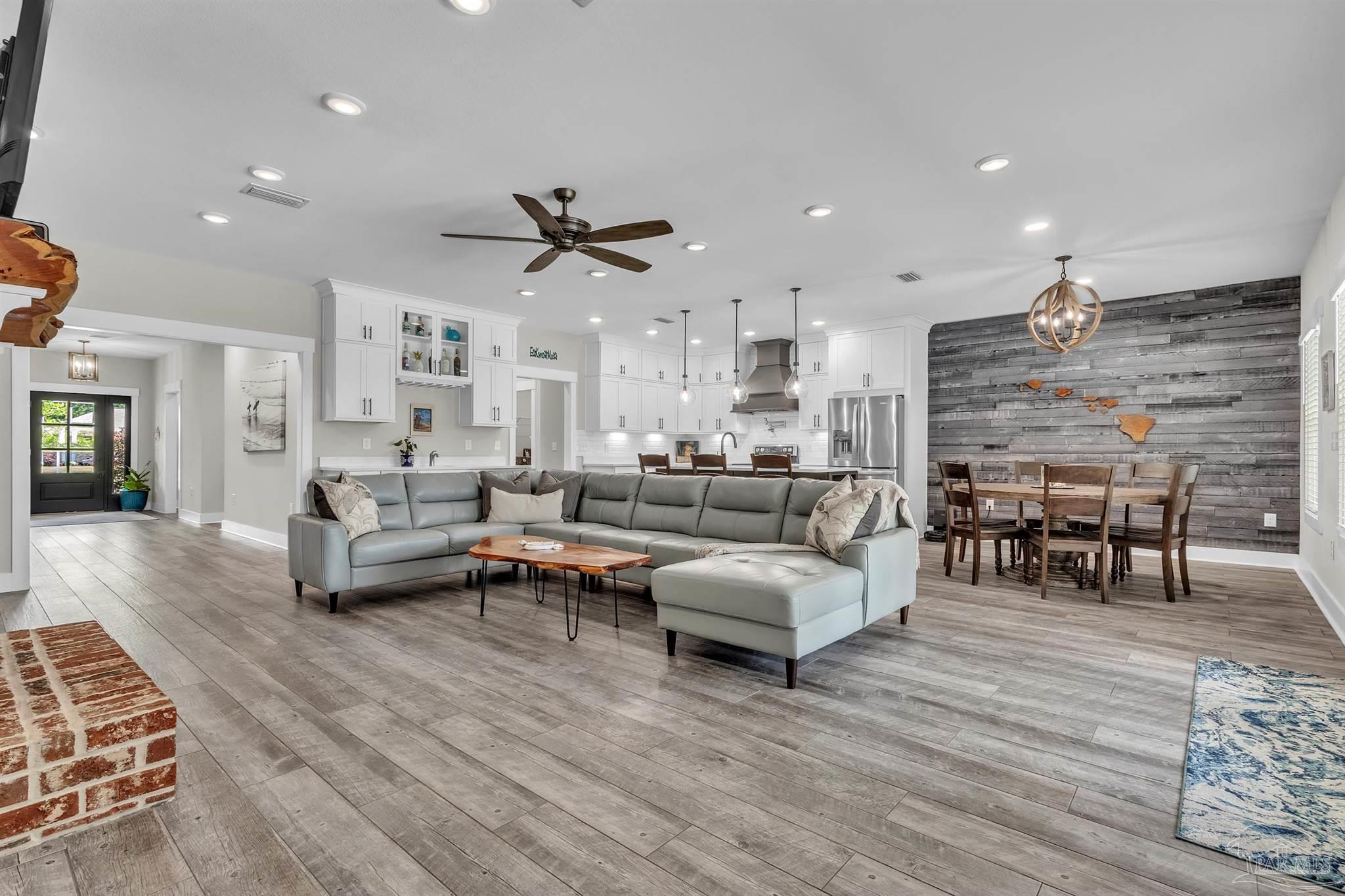 107 Countri Lane Cantonment, FL 32533 - Photo 1 of 35 a living room with furniture and a wooden floor