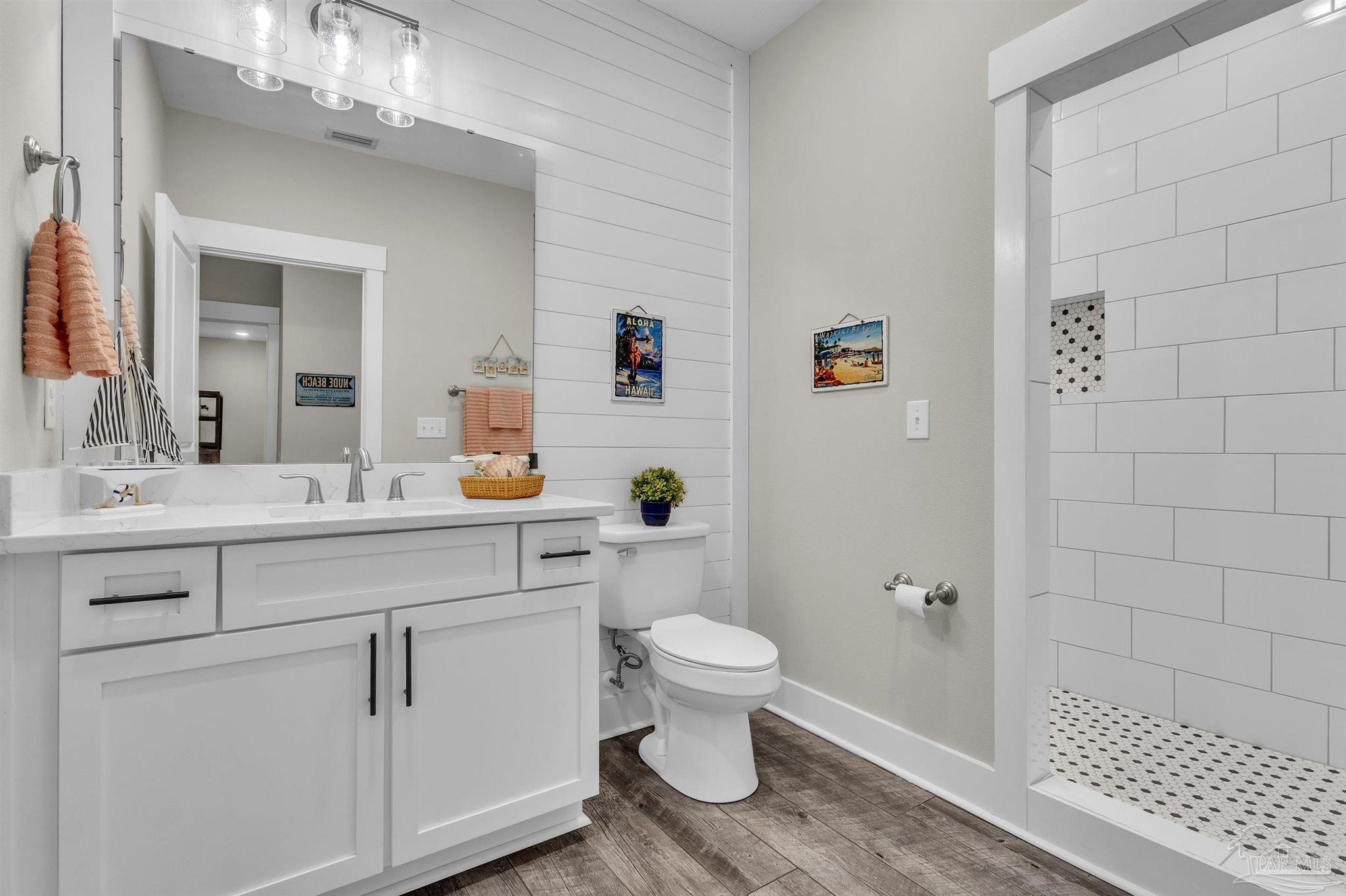 107 Countri Lane Cantonment, FL 32533 - Photo 15 of 35 a bathroom with a sink a toilet and shower