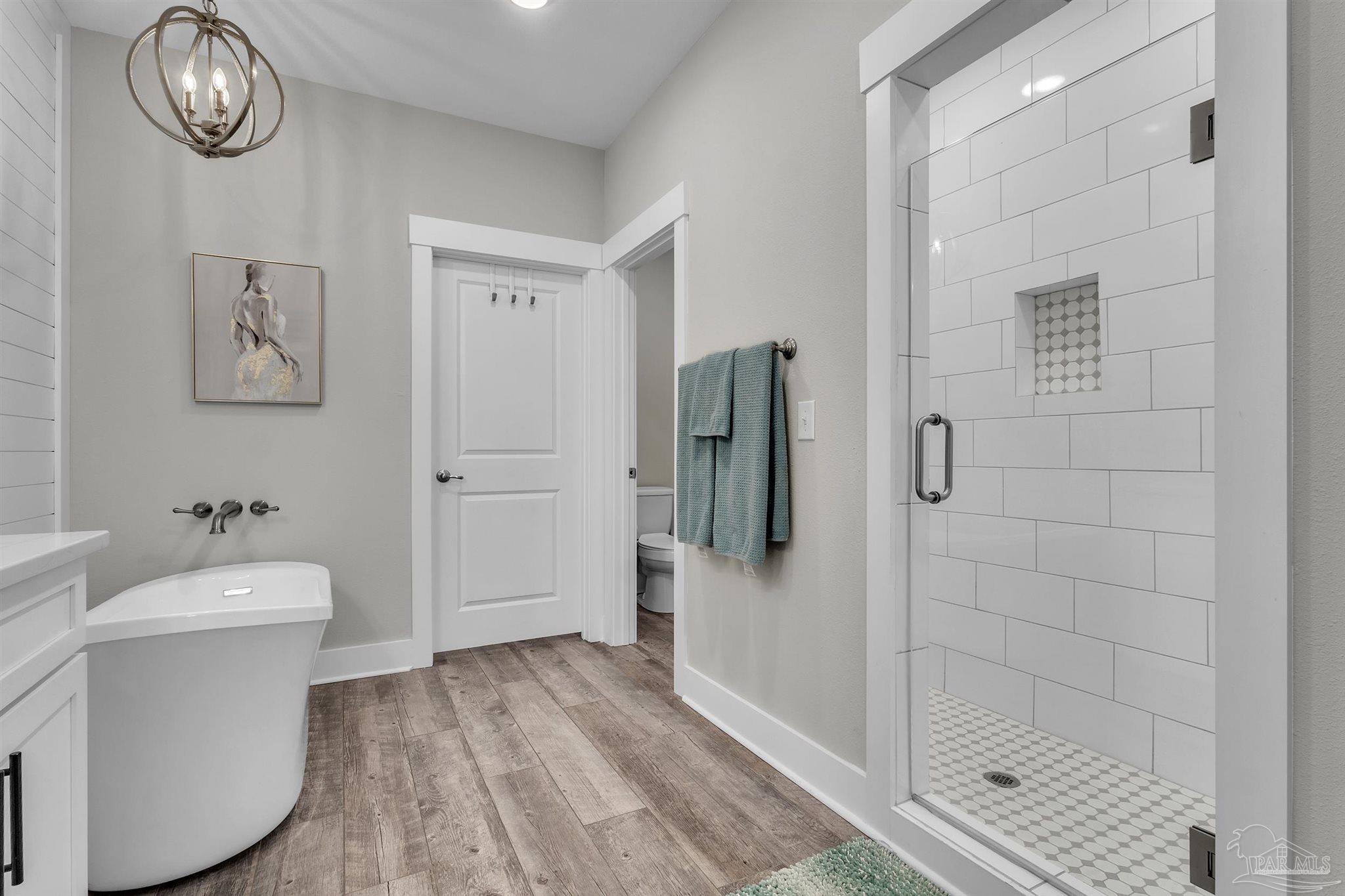 107 Countri Lane Cantonment, FL 32533 - Photo 22 of 35 a bathroom with a bathtub and a shower