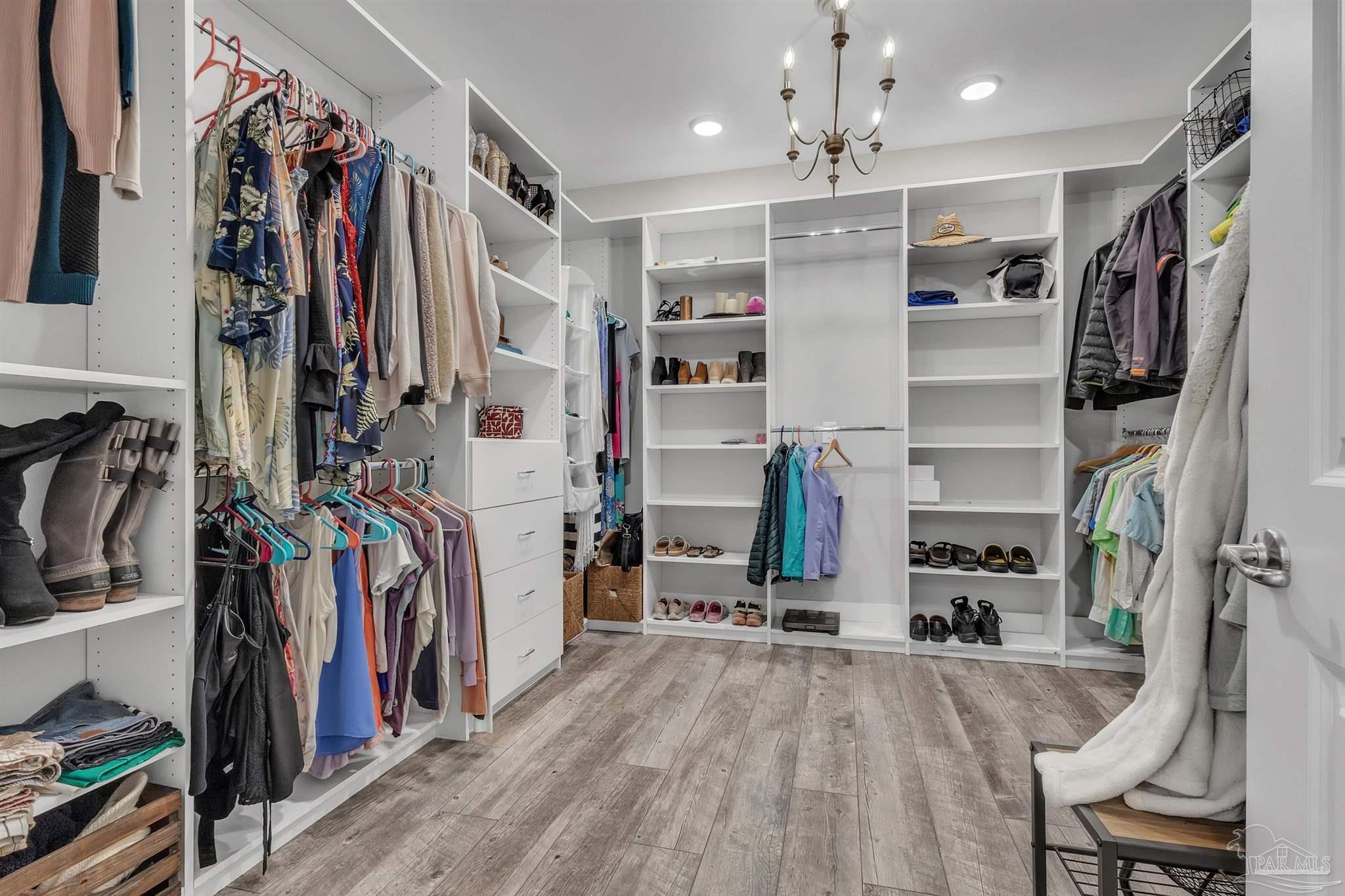 107 Countri Lane Cantonment, FL 32533 - Photo 23 of 35 a view of a living room with clothes and shoes