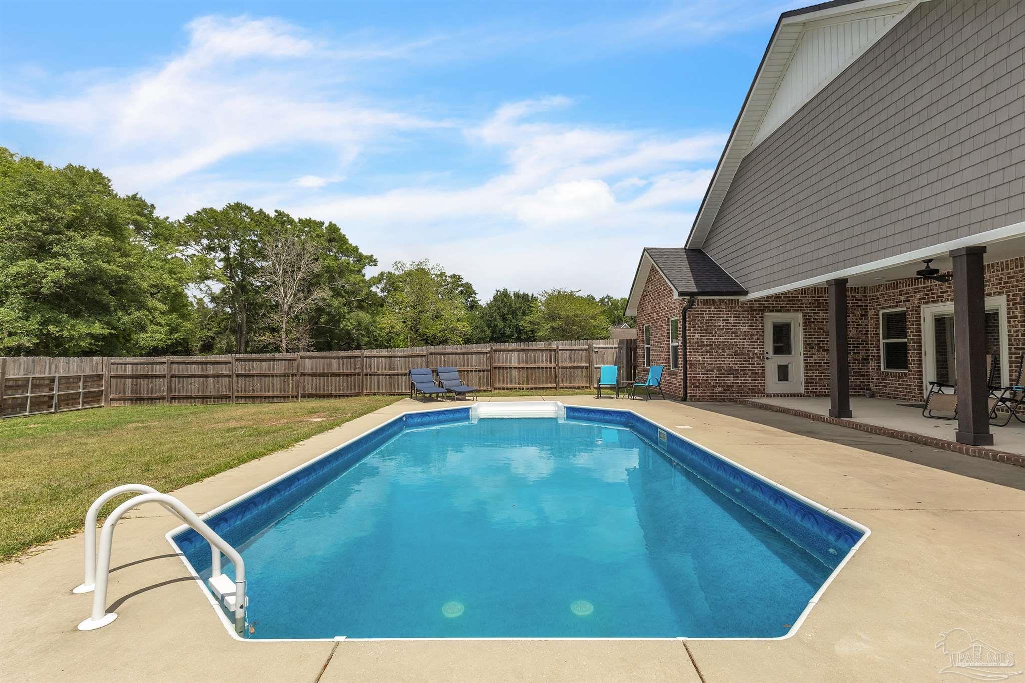 107 Countri Lane Cantonment, FL 32533 - Photo 25 of 35 a view of swimming pool with seating area