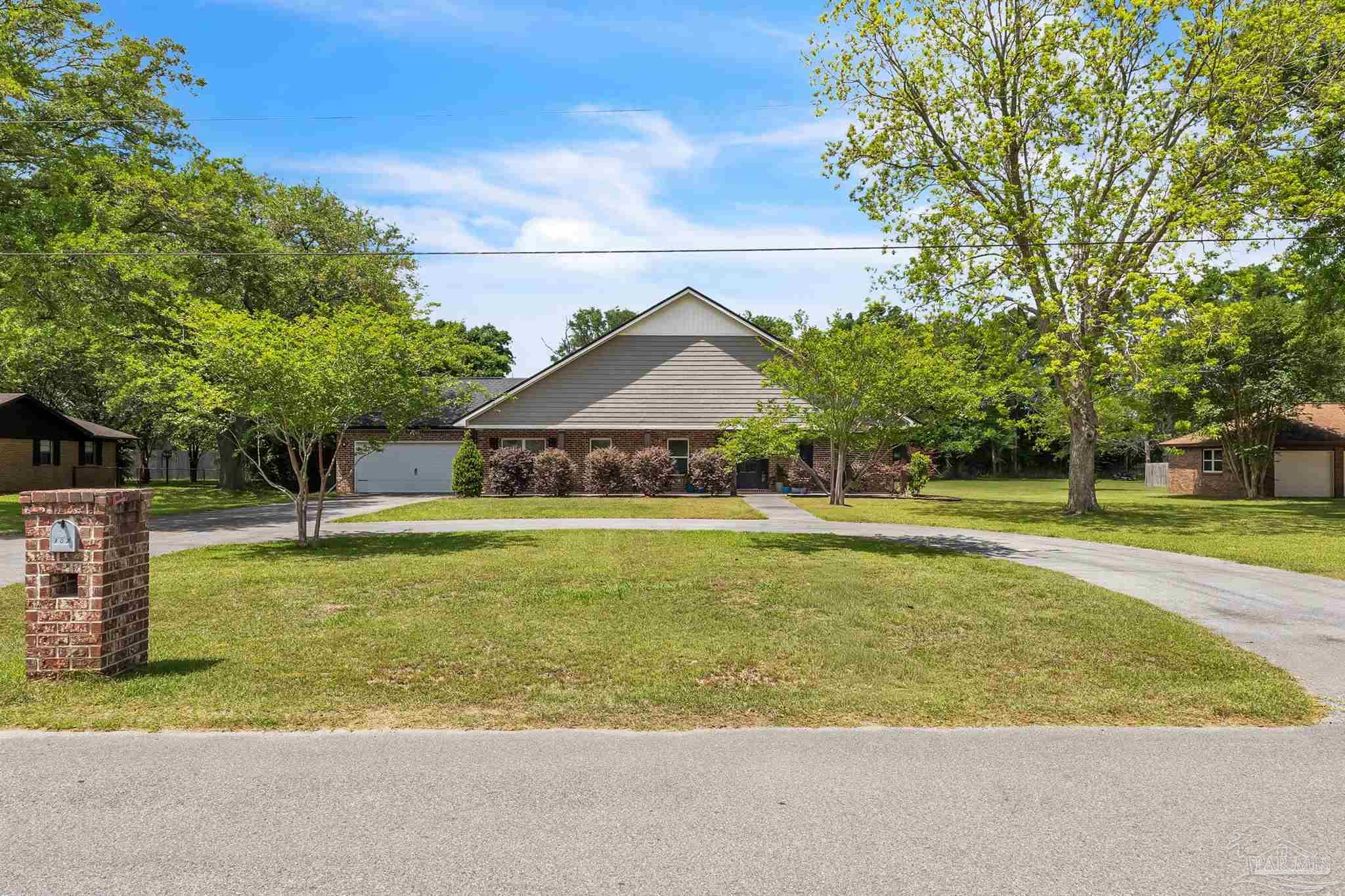 107 Countri Lane Cantonment, FL 32533 - Photo 33 of 35 a view of a swimming pool with an outdoor space and seating area