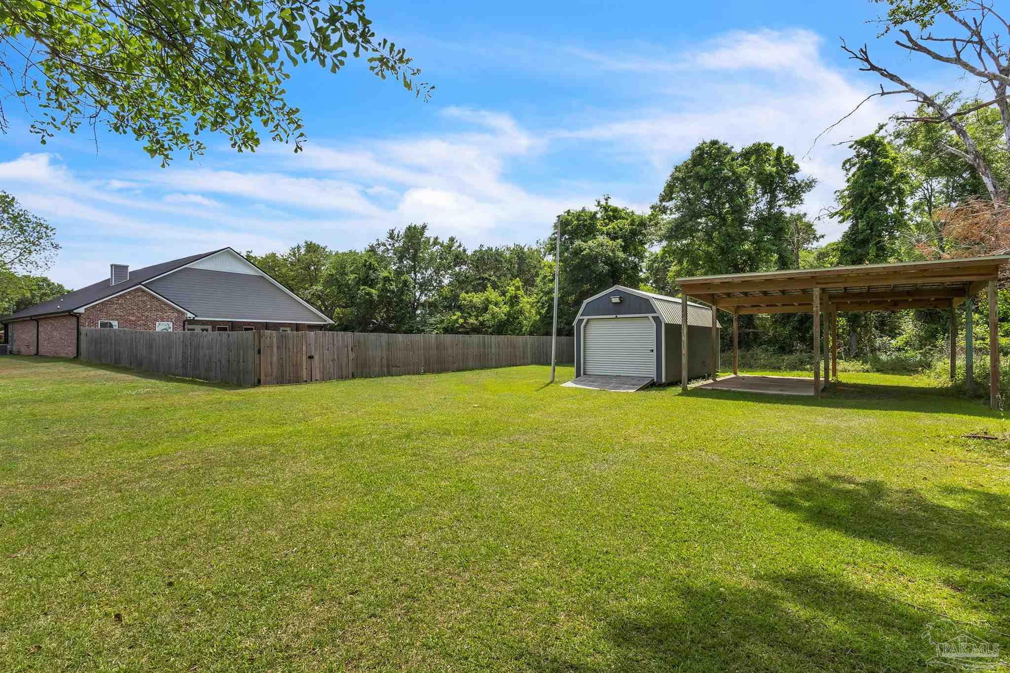 107 Countri Lane Cantonment, FL 32533 - Photo 34 of 35 a view of a house with backyard and pool