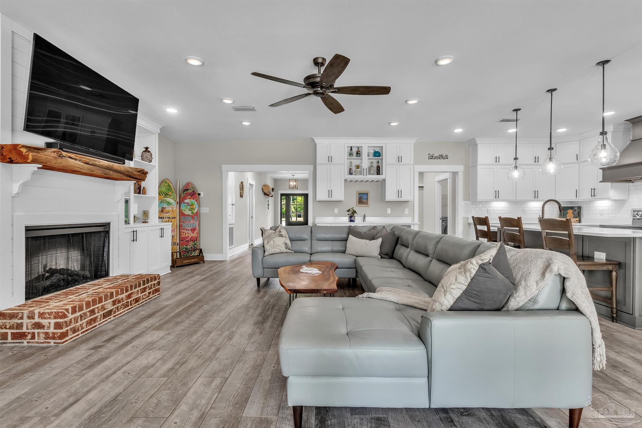 107 Countri Lane Cantonment, FL 32533 - Photo 5 of 35 a living room with fireplace furniture and a flat screen tv