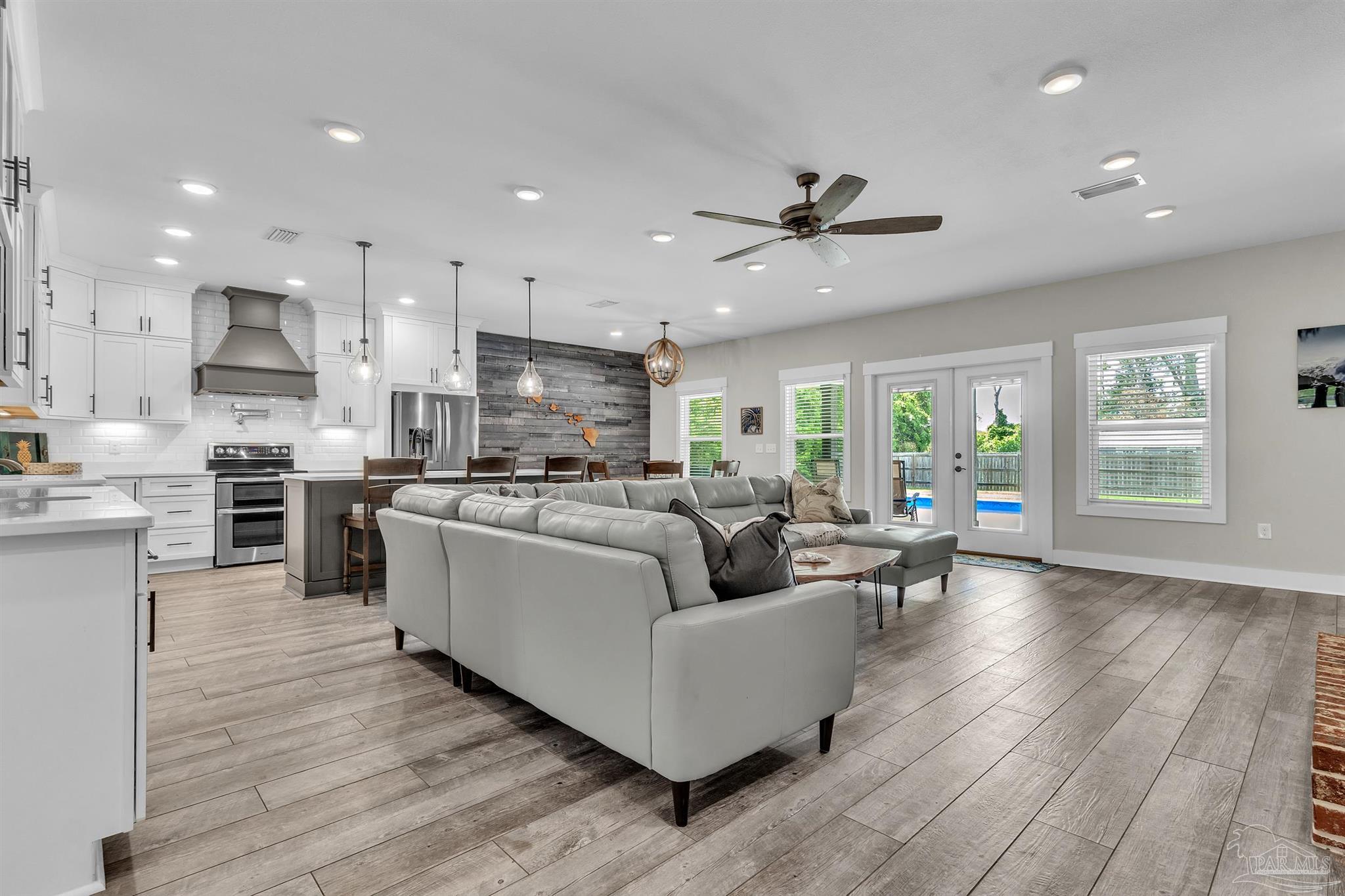 107 Countri Lane Cantonment, FL 32533 - Photo 6 of 35 a living room with stainless steel appliances furniture and a view of kitchen