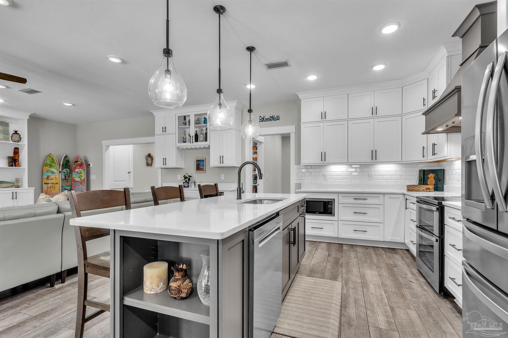 107 Countri Lane Cantonment, FL 32533 - Photo 8 of 35 a large kitchen with cabinets