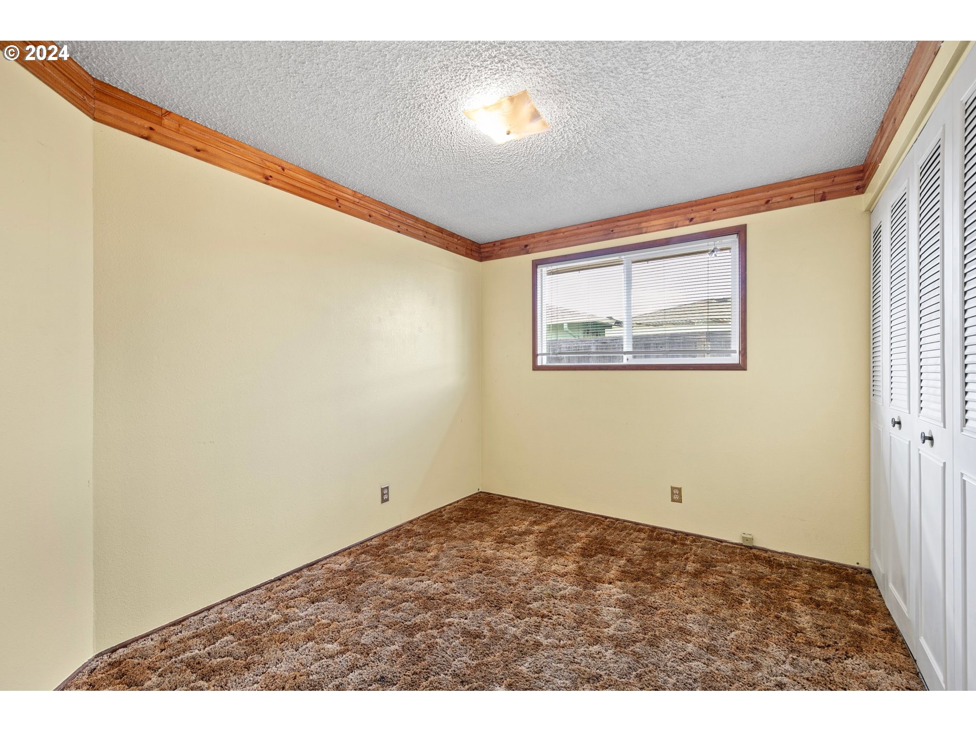1073 56th Place Springfield, OR 97478 - Photo 14 of 27 a view of an empty room and window