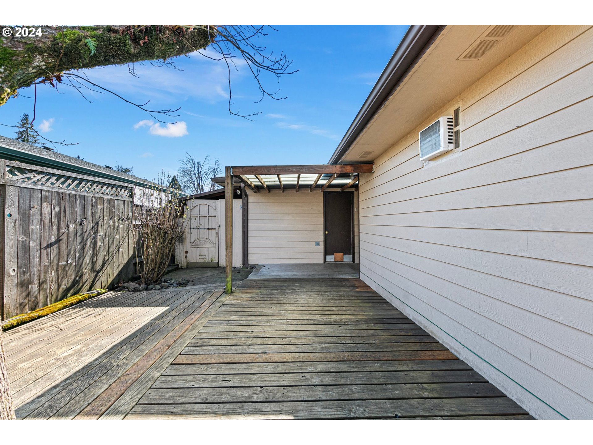 1073 56th Place Springfield, OR 97478 - Photo 23 of 27 a view of a backyard with wooden fence