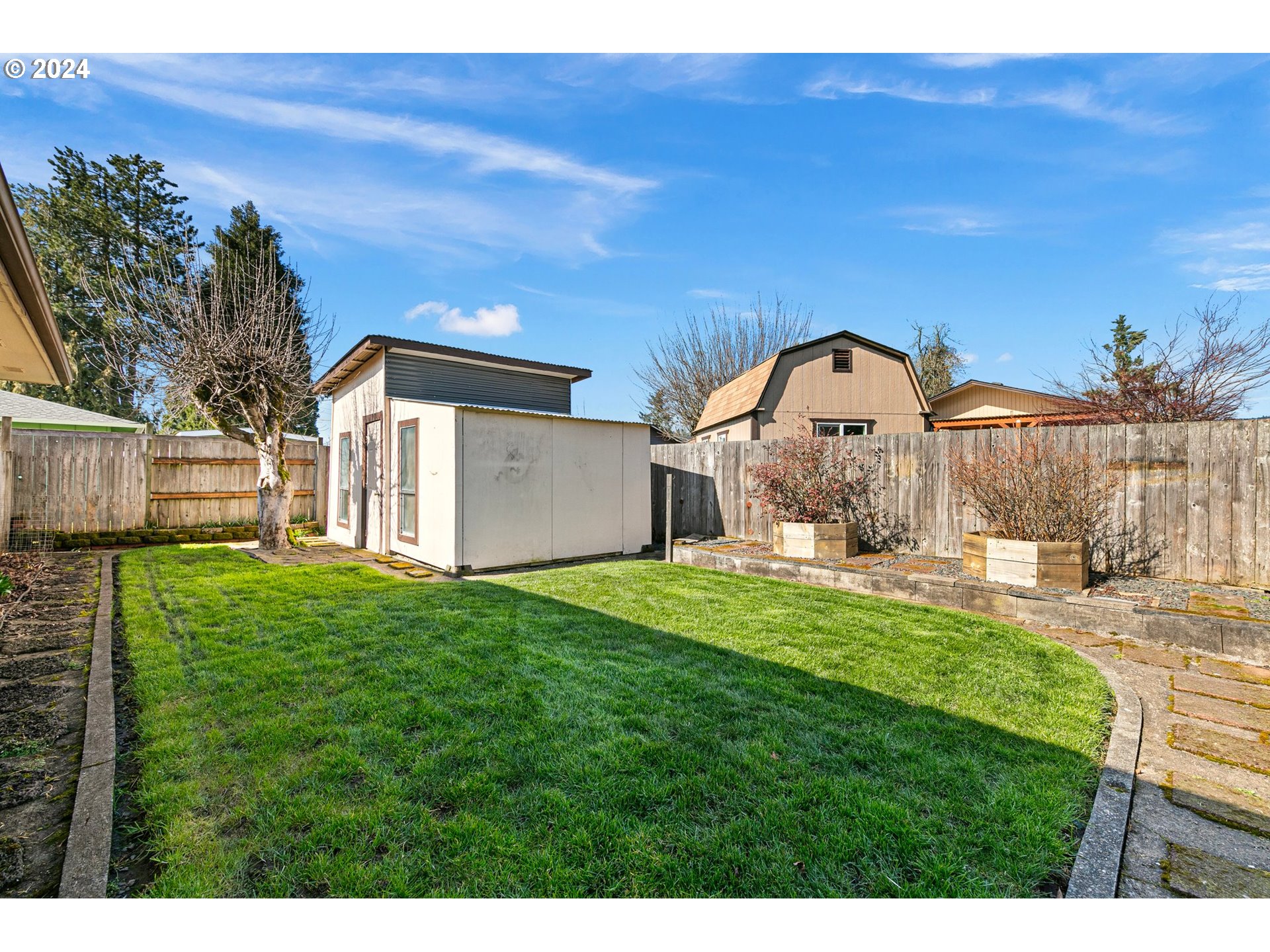 1073 56th Place Springfield, OR 97478 - Photo 26 of 27 a backyard of a house with table and chairs
