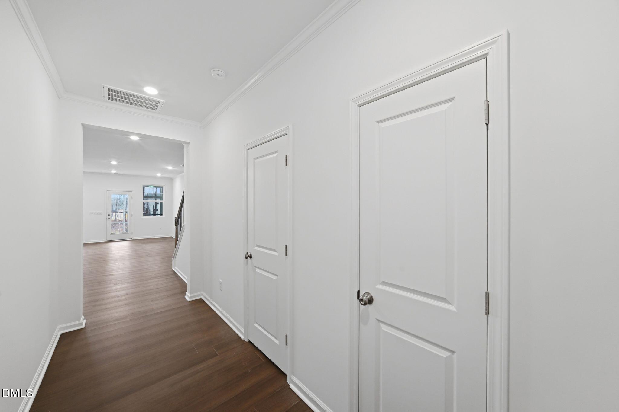 125 Tree Moss Court Rolesville, NC 27571 - Photo 13 of 30 a view of a hallway with wooden floor