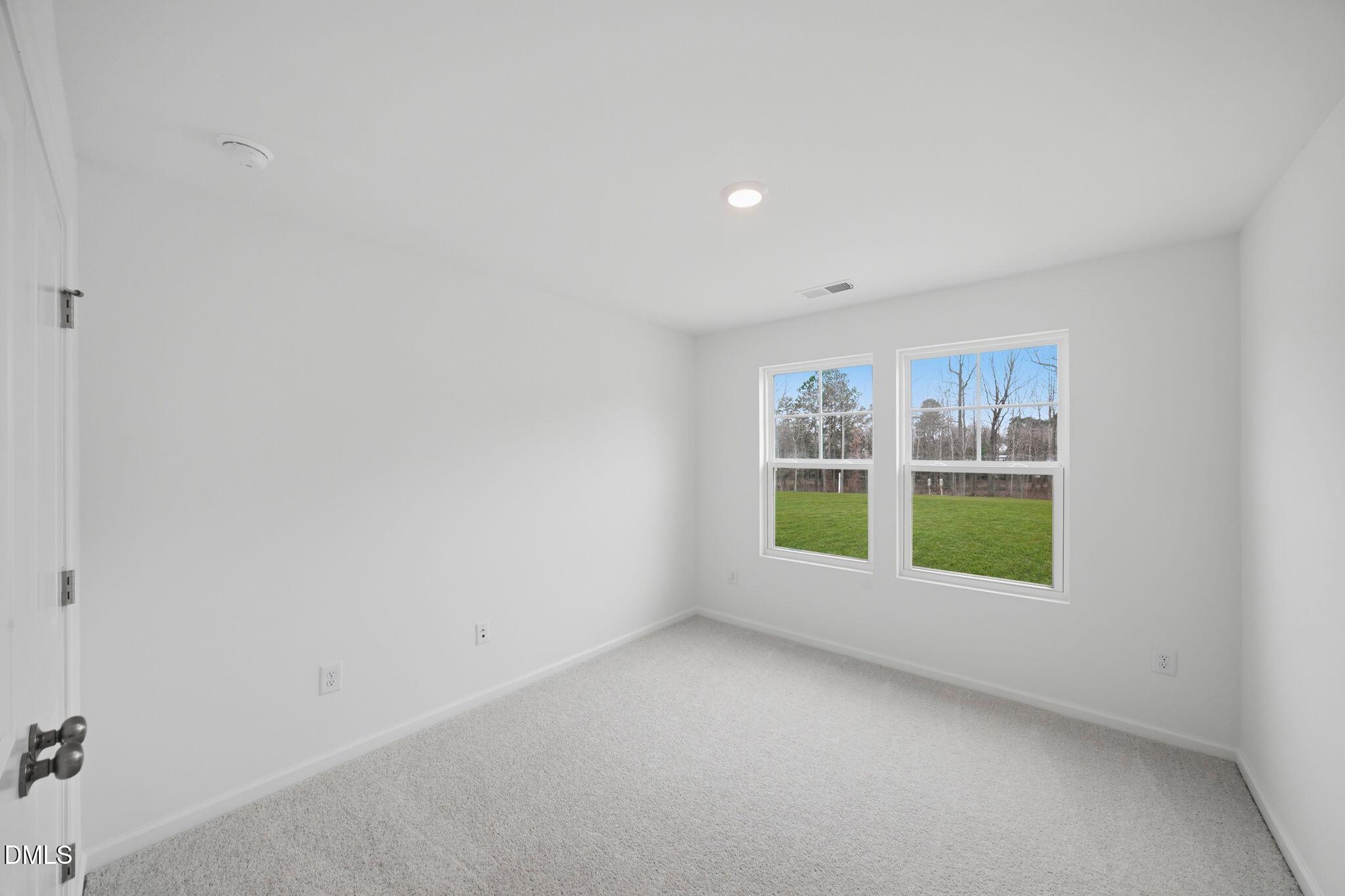 125 Tree Moss Court Rolesville, NC 27571 - Photo 16 of 30 a view of an empty room with a window