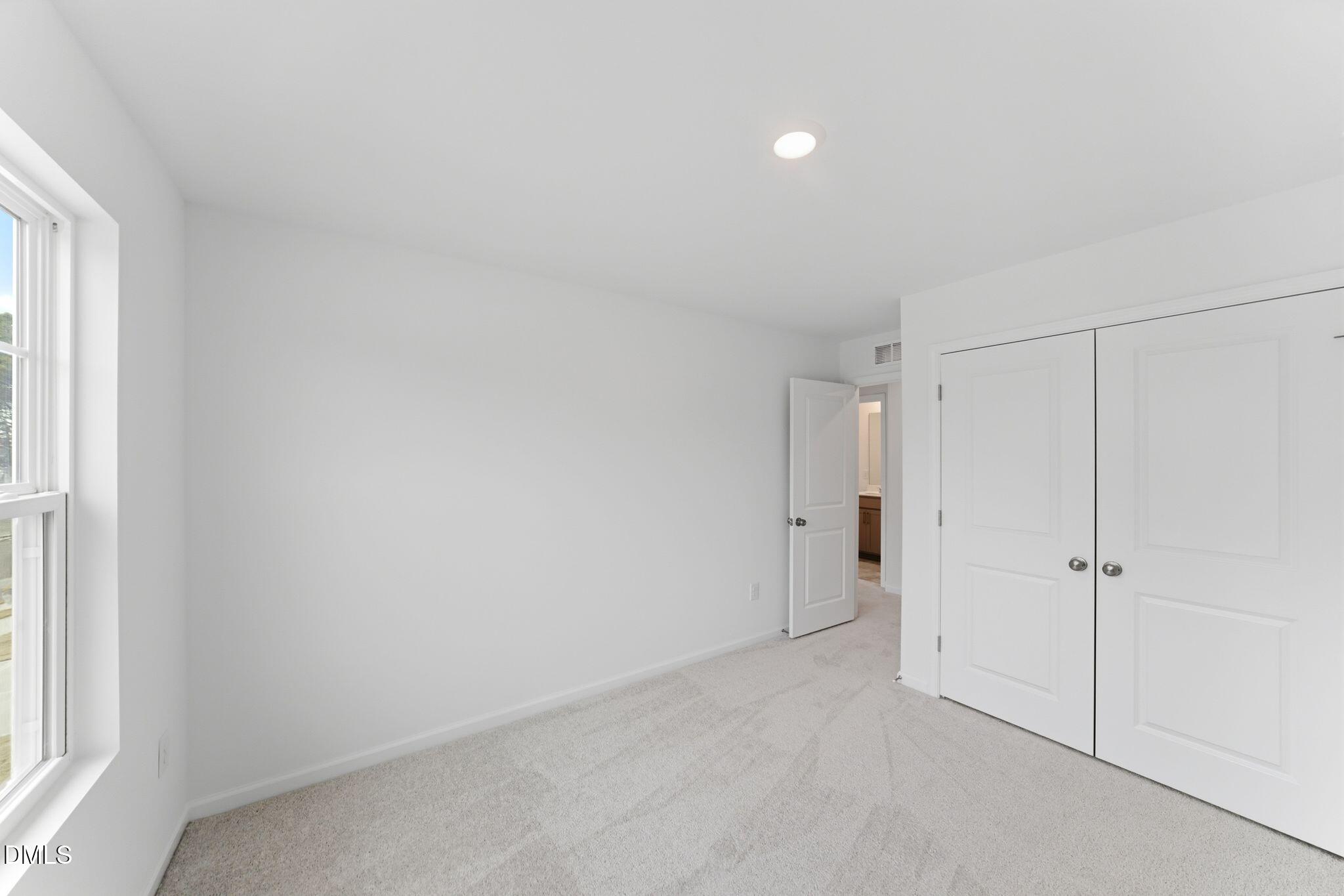 125 Tree Moss Court Rolesville, NC 27571 - Photo 17 of 30 a view of an empty room