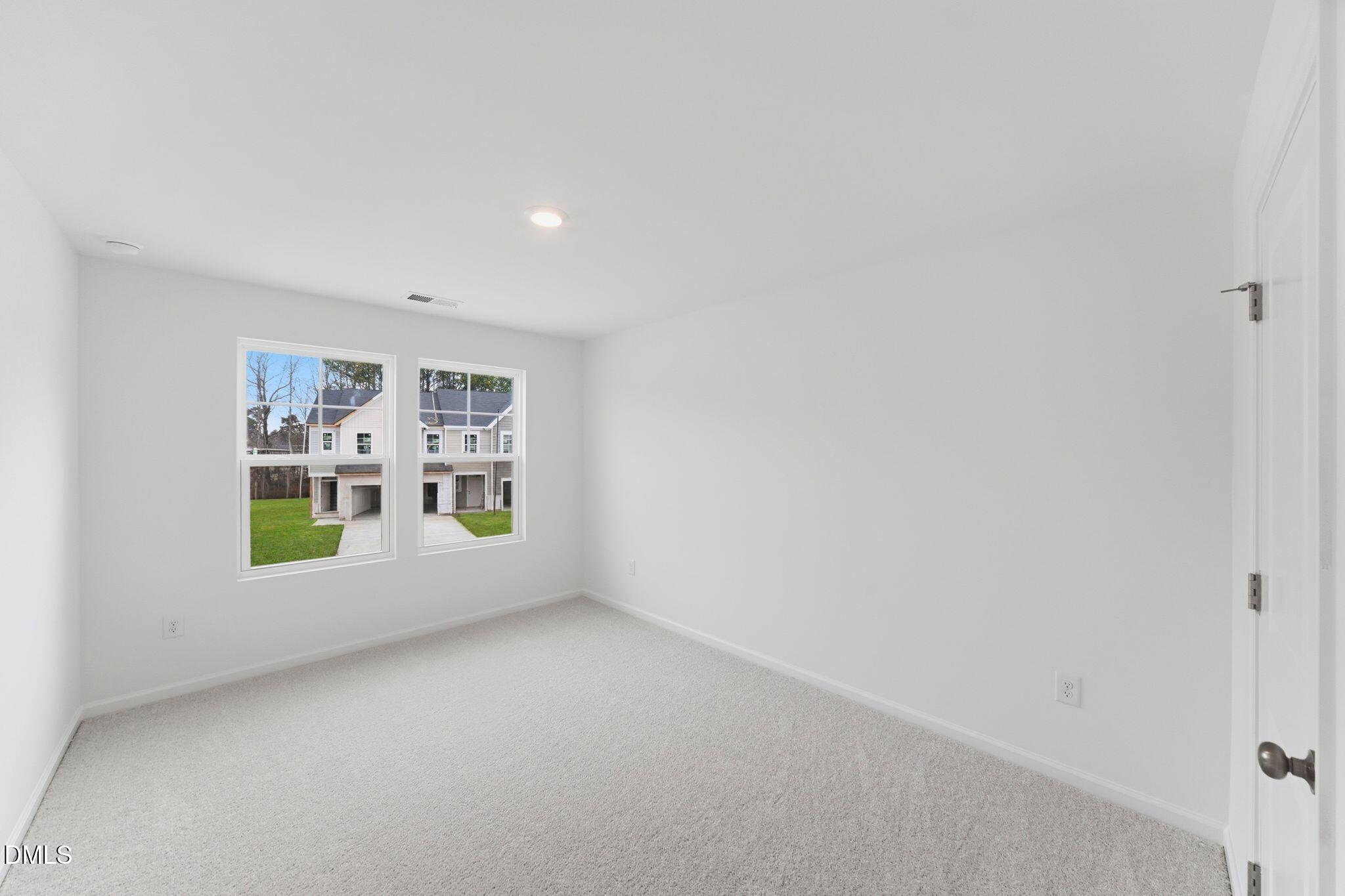 125 Tree Moss Court Rolesville, NC 27571 - Photo 18 of 30 a view of an empty room with a window