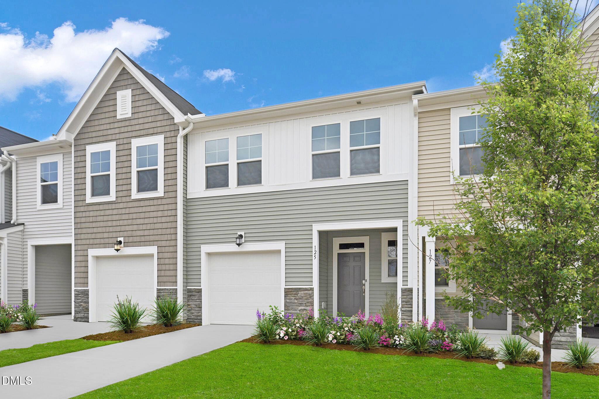 125 Tree Moss Court Rolesville, NC 27571 - Photo 2 of 30 a front view of house with yard and green space