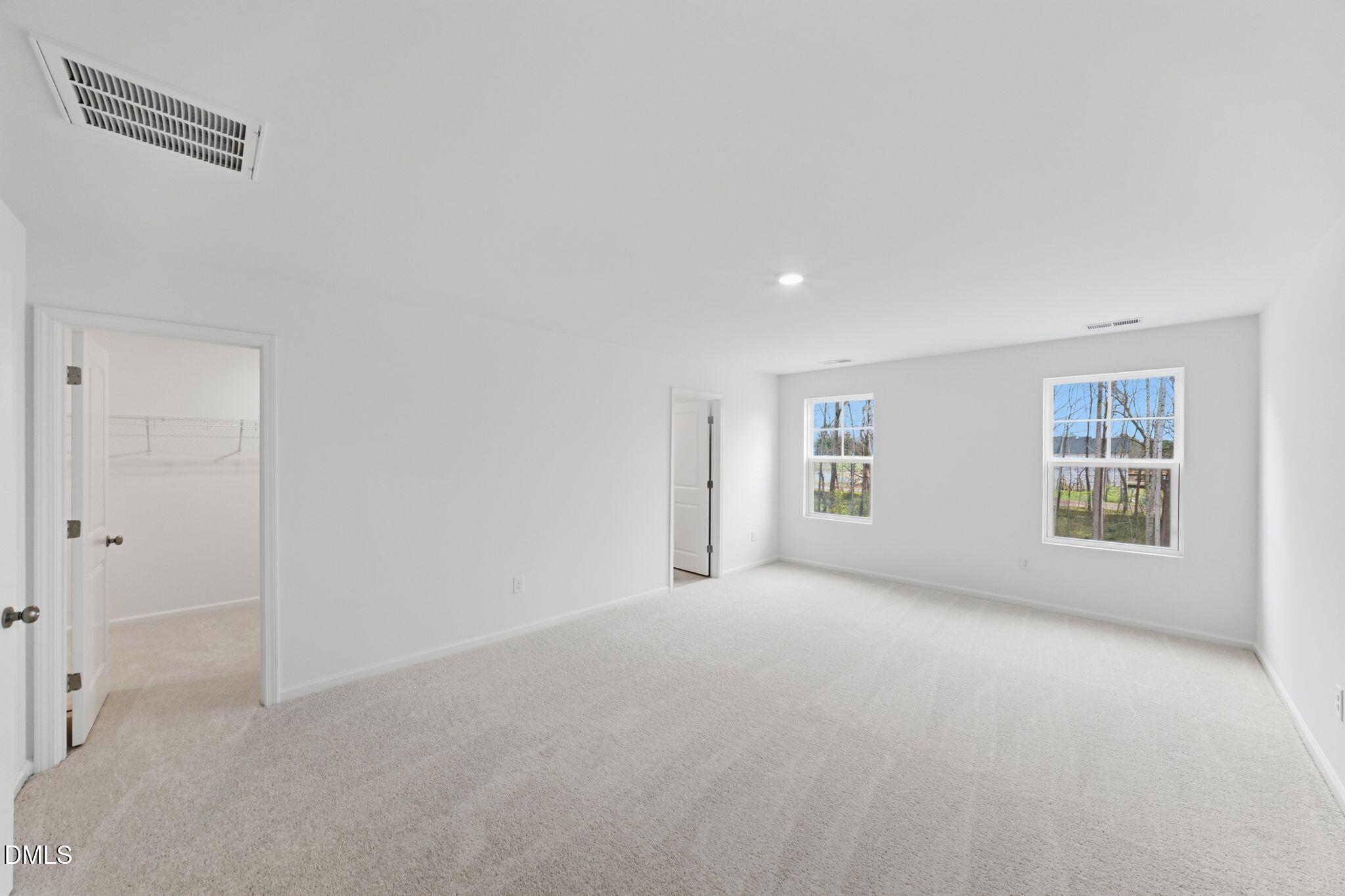 125 Tree Moss Court Rolesville, NC 27571 - Photo 21 of 30 a view of an empty room with a window