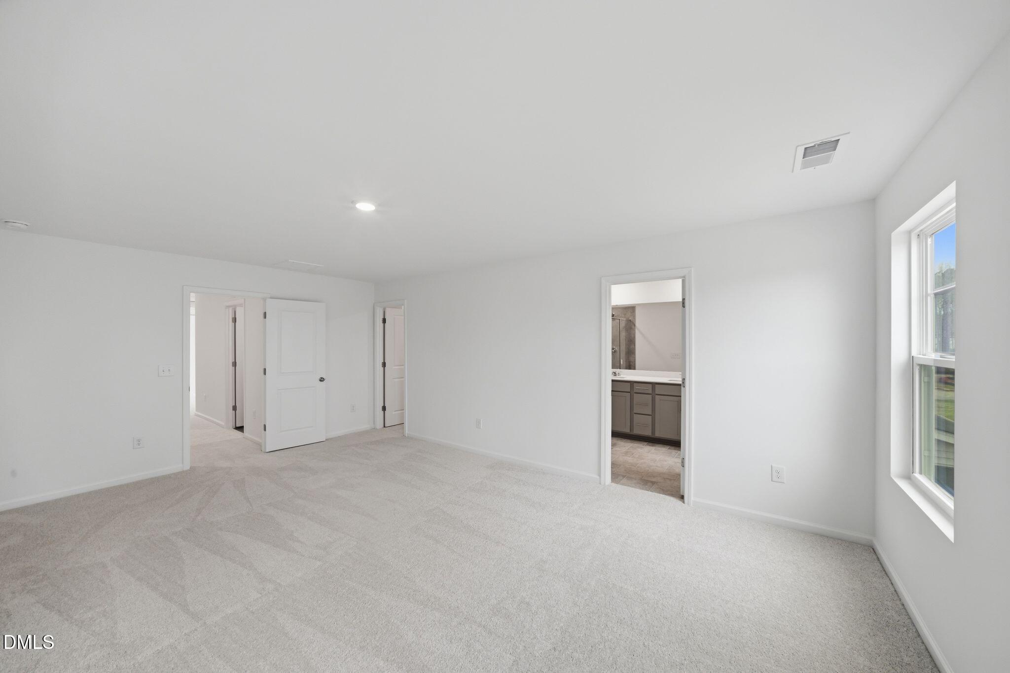 125 Tree Moss Court Rolesville, NC 27571 - Photo 23 of 30 an empty room with windows and closet