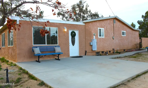 a house with trees in the background