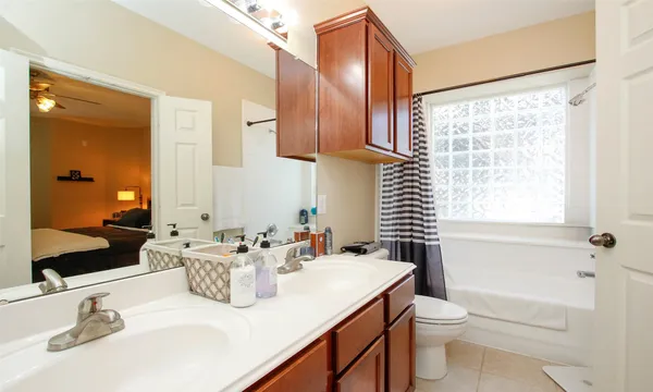 a bathroom with a sink a toilet and tub