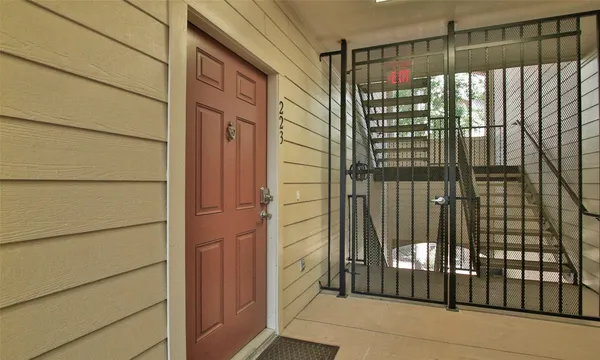 a view of a door and a window