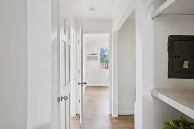 a view of a bathroom from a hallway
