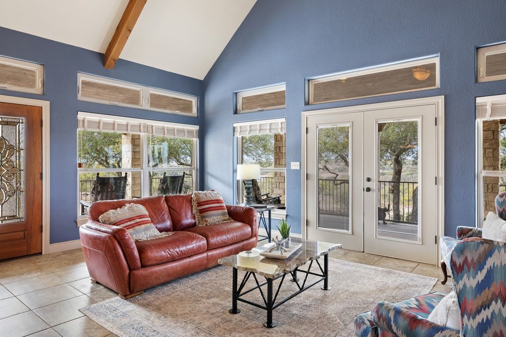 232 Crooked Oak Round Mountain, TX 78663 - Photo 8 of 40 Living room with french doors, high vaulted ceiling, light tile patterned floors, and beam ceiling