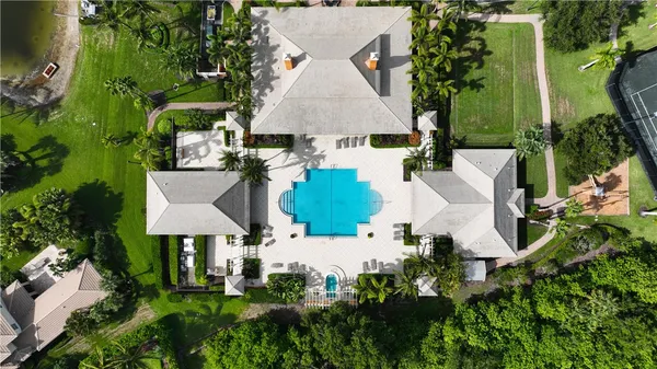 an aerial view of multiple houses with outdoor space