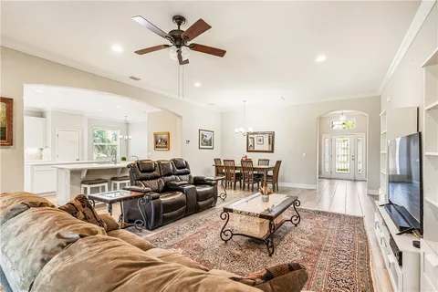 a living room with furniture fireplace and a flat screen tv