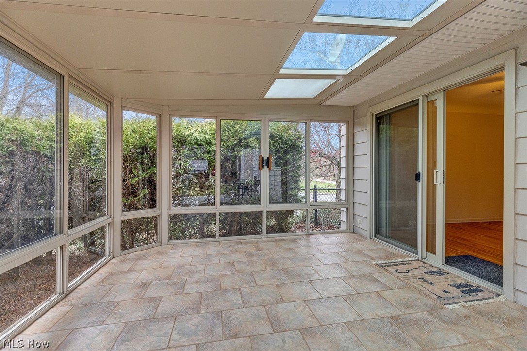 2990 Hampton Road Cleveland, OH 44120 - Photo 15 of 29 Unfurnished sunroom with stone finish floors, a skylight, and french doors